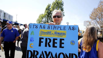 Jun 13, 2016; Oakland, CA, USA; Golden State Warriors fan Doug Anderson holds up a sign in support of Golden State Warriors suspended forward Draymond Green (not pictured) before game five of the NBA Finals against the Cleveland Cavaliers at Oracle Arena. Mandatory Credit: Kelley L Cox-USA TODAY Sports