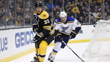 Nov 22, 2016; Boston, MA, USA; Boston Bruins defenseman Zdeno Chara (33) clears the puck away from St. Louis Blues center Jori Lehtera (12) during the first period at TD Garden. Mandatory Credit: Greg M. Cooper-USA TODAY Sports