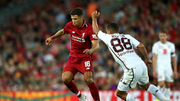 LIVERPOOL, ENGLAND - AUGUST 07: Marko Grujic of Liverpool holds off Tomas Rincon of Torino during the pre-season friendly match between Liverpool and Torino at Anfield on August 7, 2018 in Liverpool, England. (Photo by Jan Kruger/Getty Images)