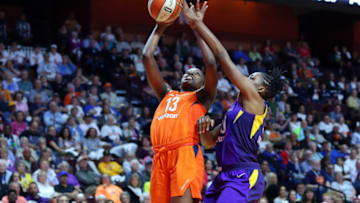 UNCASVILLE, CT - MAY 24: Connecticut Sun forward Chiney Ogwumike (13) shoots over Los Angeles Sparks forward Nneka Ogwumike (30) during a WNBA game between Los Angeles Sparks and Connecticut Sun on May 24, 2018, at Mohegan Sun Arena in Uncasville, CT. Connecticut defeated Los Angeles 102-94. (Photo by M. Anthony Nesmith/Icon Sportswire via Getty Images)
