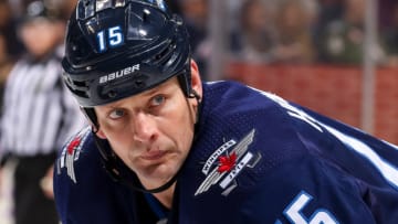 WINNIPEG, MB - NOVEMBER 27: Matt Hendricks #15 of the Winnipeg Jets looks on during a second period face-off against the Minnesota Wild at the Bell MTS Place on November 27, 2017 in Winnipeg, Manitoba, Canada. The Jets defeated the Wild 7-2. (Photo by Jonathan Kozub/NHLI via Getty Images)