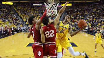 ANN ARBOR, MICHIGAN - JANUARY 06: Charles Matthews #1 of the Michigan Wolverines tries to get a second half shot off around Clifton Moore #22 and Justin Smith #3 of the Indiana Hoosiers at Crisler Arena on January 06, 2019 in Ann Arbor, Michigan. Michigan won the game 74-63. (Photo by Gregory Shamus/Getty Images)