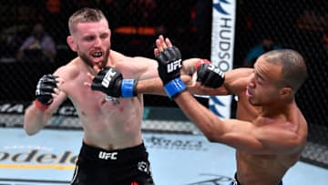 Mar 6, 2021; Las Vegas, NV, USA; Tim Elliott punches Jordan Espinosa in their flyweight fight during the UFC 259 event at UFC APEX on March 06, 2021 in Las Vegas, Nevada. Mandatory Credit: Jeff Bottari/Handout Photo via USA TODAY Sports