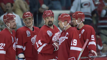 RALEIGH, NC - JUNE 10: Fredrik Olausson #27, Sergei Fedorov #91, Brendan Shanahan #14, Steve Yzerman #19 and Nicklas Lidstrom #5 of the Detroit Red Wings celebrate during game four of the NHL Stanley Cup Finals against the Carolina Hurricanes on June 10, 2002 at Entertainment Sports Arena in Raleigh, North Carolina. The Red Wings won 3-0. (Photo by Elsa/Getty Images/NHLI)