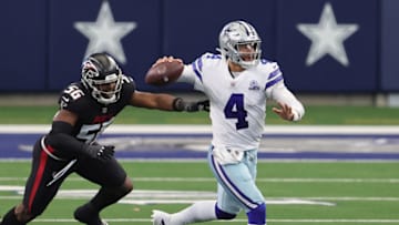 Sep 20, 2020; Arlington, Texas, USA; Dallas Cowboys quarterback Dak Prescott (4) throws on the run against Atlanta Falcons linebacker Dante Fowler Jr. (56) at AT&T Stadium. Mandatory Credit: Matthew Emmons-USA TODAY Sports