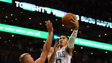 BOSTON, MA - DECEMBER 13: Jayson Tatum #0 of the Boston Celtics shoots the ball against Mason Plumlee #24 of the Denver Nuggets during the second half at TD Garden on December 13, 2017 in Boston, Massachusetts. (Photo by Tim Bradbury/Getty Images)