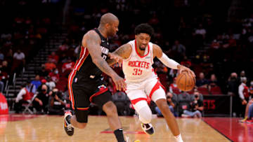 Houston Rockets center Christian Wood (35, right) handles the ball while Miami Heat forward P.J. Tucker (17) defends( Erik Williams-USA TODAY Sports)