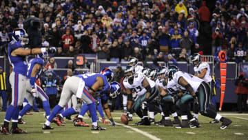 EAST RUTHERFORD, NJ - DECEMBER 13: Center Jamaal Jackson #67 of the Philadelphia Eagles gets ready to snap the ball during a NFL game against the New York Giants on December 13, 2009 at Giants Stadium in East Rutherford, New Jersey. The Eagles beat the Giants 45-38. (Photo by Jim Luzzi/Sports Imagery/Getty Images)