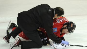 Oct 28, 2014; Calgary, Alberta, CAN; Calgary Flames center Matt Stajan (18) is injured during the third period against the Montreal Canadiens at Scotiabank Saddledome. Canadiens won 2-1 in a shootout. Mandatory Credit: Candice Ward-USA TODAY Sports