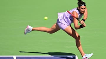 Caroline Garcia of France hits a backhand return from the corner baseline to Leylah Fernandez of Canada in their third round match at the 2023 WTA Indian Wells Open in Indian Wells, California, on March 13, 2023. (Photo by Frederic J. BROWN / AFP) (Photo by FREDERIC J. BROWN/AFP via Getty Images)