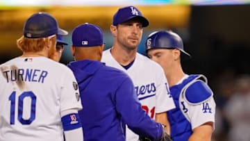 Oct 6, 2021; Los Angeles, California, USA; Los Angeles Dodgers starting pitcher Max Scherzer (31) reacts as manager Dave Roberts (30) takes him out of the game against the St. Louis Cardinals during the fifth inning at Dodger Stadium. Mandatory Credit: Robert Hanashiro-USA TODAY Sports