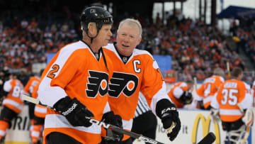 PHILADELPHIA, PA - DECEMBER 31: Bobby Clarke #16 and Mark Howe #2 of the Philadelphia Flyers talk before playing against the New York Rangers during the 2012 Bridgestone NHL Winter Classic Alumni Game on December 31, 2011 at Citizens Bank Park in Philadelphia, Pennsylvania. (Photo by Jim McIsaac/Getty Images)
