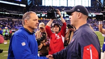 Dec 20, 2015; Indianapolis, IN, USA; Indianapolis Colts head coach Chuck Pagano (L) shakes hands with Houston Texans head coach Bill O