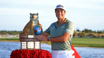 NASSAU, BAHAMAS - DECEMBER 05: Viktor Hovland of Norway poses with the trophy after winning the Hero World Challenge at Albany Golf Course on December 05, 2021 in Nassau, . (Photo by Mike Ehrmann/Getty Images)