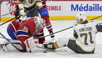 Nov 16, 2023; Montreal, Quebec, CAN; Montreal Canadiens goalie Cayden Primeau (30) stops Vegas Golden Knights forward William Karlsson (71) during the first period at the Bell Centre. Mandatory Credit: Eric Bolte-USA TODAY Sports