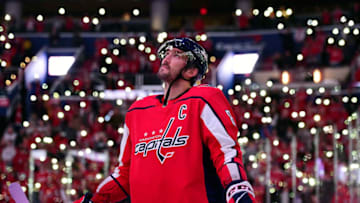 WASHINGTON, DC - NOVEMBER 23: Alex Ovechkin #8 of the Washington Capitals stands on the ice with his teammates and the Detroit Red Wings for a NHL-wide moment of silence for Hockey Fights Cancer before their game at Capital One Arena on November 23, 2018 in Washington, DC. (Photo by Patrick McDermott/NHLI via Getty Images)
