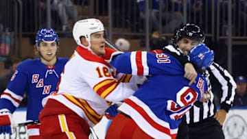 NEW YORK, NEW YORK - FEBRUARY 06: Nikita Zadorov #16 of the Calgary Flames goes after Sammy Blais #91 of the New York Rangers following his check on Milan Lucic #17 (not shown) during the first period at Madison Square Garden on February 06, 2023 in New York City. (Photo by Bruce Bennett/Getty Images)