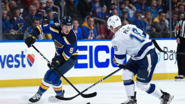 ST. LOUIS, MO - NOVEMBER 19: Ondrej Palat #18 of the Tampa Bay Lightning pressures Sammy Blais #9 of the St. Louis Blues at Enterprise Center on November 19, 2019 in St. Louis, Missouri. (Photo by Joe Puetz/NHLI via Getty Images)