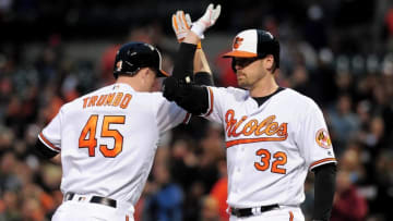 May 18, 2016; Baltimore, MD, USA; Baltimore Orioles designated hitter Mark Trumbo (45) celebrates with catcher Matt Wieters (32) after hitting a home run in the second inning against the Seattle Mariners at Oriole Park at Camden Yards. Mandatory Credit: Evan Habeeb-USA TODAY Sports