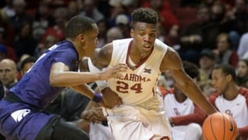 Jan 9, 2016; Norman, OK, USA; Oklahoma Sooners guard Buddy Hield (24) drives to the basket in front of Kansas State Wildcats guard Barry Brown (5) during the second half at Lloyd Noble Center. Mandatory Credit: Mark D. Smith-USA TODAY Sports