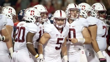 Oct 29, 2016; Tucson, AZ, USA; Stanford Cardinal running back Christian McCaffrey (5) is congratulated by teammates after scoring a touchdown against the Arizona Wildcats during the second quarter at Arizona Stadium. Mandatory Credit: Casey Sapio-USA TODAY Sports