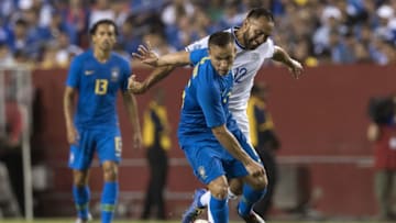 Brazil's midfielder Arthur (C) vies for the ball with El Salvador's midfielder Arturo Alvarez (R) during the international friendly match between El Salvador and Brazil at FedEx Field in Landover, Maryland on September 11, 2018. (Photo by JIM WATSON / AFP) (Photo credit should read JIM WATSON/AFP/Getty Images)