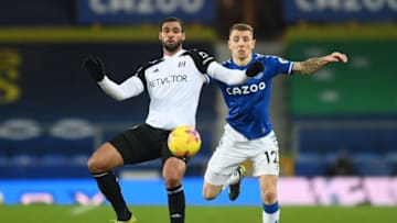 LIVERPOOL, ENGLAND - FEBRUARY 14: Lucas Digne of Everton and Ruben Loftus-Cheek of Fulham battle for the ball during the Premier League match between Everton and Fulham at Goodison Park on February 14, 2021 in Liverpool, England. Sporting stadiums around the UK remain under strict restrictions due to the Coronavirus Pandemic as Government social distancing laws prohibit fans inside venues resulting in games being played behind closed doors. (Photo by Michael Regan/Getty Images)