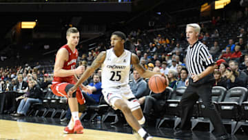 Kevin Johnson of the Cincinnati Bearcats dribbles the ball by Jack McVeigh. Getty Images.