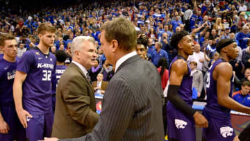 Kansas Jayhawks head coach Bill Self congratulates K-State basketball head coach Bruce Weber and players after the win at Allen Fieldhouse. Kansas won 90 to 88. Mandatory Credit: Denny Medley-USA TODAY Sports