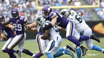 Sep 25, 2016; Charlotte, NC, USA; Carolina Panthers running back Cameron Artis-Payne (34) is tackled by Minnesota Vikings free safety Harrison Smith (22) in the second quarter at Bank of America Stadium. Mandatory Credit: Bob Donnan-USA TODAY Sports