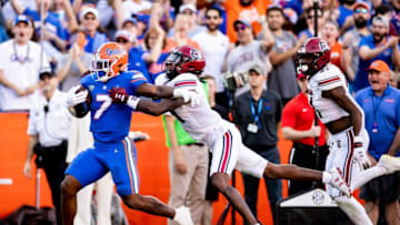 Florida Gators running back Trevor Etienne (7) breaks a tackle at the goalline for a 80+ yard touchdown during the first half against the South Carolina Gamecocks at Steve Spurrier Field at Ben Hill Griffin Stadium in Gainesville, FL on Saturday, November 12, 2022. [Matt Pendleton/Gainesville Sun]Ncaa Football Florida Gators Vs South Carolina GamecocksSyndication Gainesville Sun