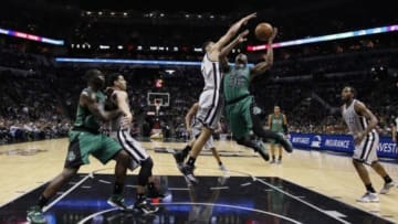 Mar 20, 2015; San Antonio, TX, USA; Boston Celtics point guard Marcus Smart (36) has his shot blocked by San Antonio Spurs power forward Tim Duncan (21) during the second half at AT&T Center. The Spurs won 101.89. Mandatory Credit: Soobum Im-USA TODAY Sports