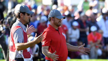 Sep 30, 2016; Chaska, MN, USA; J.B. Holmes of the United States and his caddie look at his putt on the 13th green in the afternoon four-ball matches during the 41st Ryder Cup at Hazeltine National Golf Club. Mandatory Credit: Michael Madrid-USA TODAY Sports