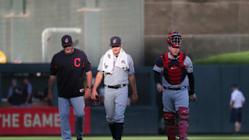MINNEAPOLIS, MN - JULY 31: Bullpen coach Ricky Pacione #82, Trevor Bauer #47 and Roberto Perez #55 of the Cleveland Indians walk to the dugout before the start of the game against the Minnesota Twins at Target Field on July 31, 2018 in Minneapolis, Minnesota. (Photo by Adam Bettcher/Getty Images)
