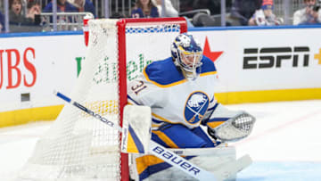 Mar 25, 2023; Elmont, New York, USA; Buffalo Sabres goaltender Eric Comrie (31) stops the puck in the second period against the New York Islanders at UBS Arena. Mandatory Credit: Wendell Cruz-USA TODAY Sports