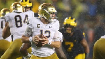 ANN ARBOR, MICHIGAN - OCTOBER 26: Ian Book #12 of the Notre Dame Fighting Irish looks to throw a first half pass against the Michigan Wolverines at Michigan Stadium on October 26, 2019 in Ann Arbor, Michigan. (Photo by Gregory Shamus/Getty Images)