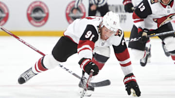 BOSTON, MA - FEBRUARY 8: Taylor Hall #91 of the Arizona Coyotes skates against the Boston Bruins at the TD Garden on February 8, 2020 in Boston, Massachusetts. (Photo by Steve Babineau/NHLI via Getty Images)