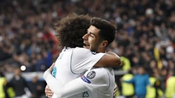(L-R) Marcelo of Real Madrid, Marco Asensio of Real Madrid during the UEFA Champions League round of 16 match between Real Madrid and Paris Saint-Germain at the Santiago Bernabeu stadium on February 14, 2018 in Madrid, Spain(Photo by VI Images via Getty Images)