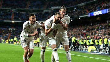 MADRID, SPAIN - MARCH 31: Karim Benzema of Real Madrid celebrates with Dani Ceballos and Gareth Bale after scoring his sides third goal during the La Liga match between Real Madrid CF and SD Huesca at Estadio Santiago Bernabeu on March 31, 2019 in Madrid, Spain. (Photo by Gonzalo Arroyo Moreno/Getty Images)