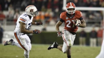 Nov 15, 2014; Athens, GA, USA; Georgia Bulldogs running back Nick Chubb (27) runs against Auburn Tigers defensive back Joe Turner (35) during the first half at Sanford Stadium. Mandatory Credit: Dale Zanine-USA TODAY Sports