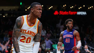 ATLANTA, GEORGIA - OCTOBER 25: John Collins #20 of the Atlanta Hawks reacts after dunking over Kelly Olynyk #13 of the Detroit Pistons during the second half at State Farm Arena on October 25, 2021 in Atlanta, Georgia. NOTE TO USER: User expressly acknowledges and agrees that, by downloading and or using this photograph, User is consenting to the terms and conditions of the Getty Images License Agreement. (Photo by Kevin C. Cox/Getty Images)