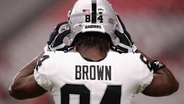 Wide receiver Antonio Brown #84 of the Oakland Raiders adjusts his helmet before the NFL preseason game against the Arizona Cardinals at State Farm Stadium on August 15, 2019 in Glendale, Arizona. (Photo by Christian Petersen/Getty Images)