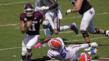 Oct 10, 2020; College Station, Texas, USA; Texas A&M Aggies quarterback Kellen Mond (11) keeps the ball for yardage during the fourth quarter against the Florida Gators at Kyle Field. Mandatory Credit: Scott Wachter-USA TODAY Sports
