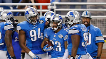 DETROIT, MI - DECEMBER 14: Darius Slay #23 of the Detroit Lions celebrates with teammates Ezekiel Ansah #94 and Andre Fluellen #96 after intercepting a pass from quarterback Teddy Bridgewater #5 of the Minnesota Vikings (not in photo) during the second quarter of the game at Ford Field on December 14, 2014 in Detroit, Michigan. (Photo by Leon Halip/Getty Images)