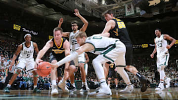 EAST LANSING, MI - DECEMBER 03: Connor McCaffery #30 of the Iowa Hawkeyes fight for a loose ball against Kyle Ahrens #0 of the Michigan State Spartans at Breslin Center on December 3, 2018 in East Lansing, Michigan. (Photo by Rey Del Rio/Getty Images)