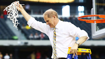 ARLINGTON, TX - MARCH 31: Head coach John Beilein of the Michigan Wolverines cuts down the net after their 79 to 59 win over the Florida Gators during the South Regional Round Final of the 2013 NCAA Men's Basketball Tournament at Dallas Cowboys Stadium on March 31, 2013 in Arlington, Texas. (Photo by Ronald Martinez/Getty Images)