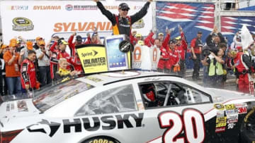 Sep 22, 2013; Loudon, NH, USA; NASCAR Sprint Cup Series driver Matt Kenseth (20) celebrates his victory of the Sylvania 300 race at New Hampshire Motor Speedway. Mandatory Credit: Greg M. Cooper-USA TODAY Sports
