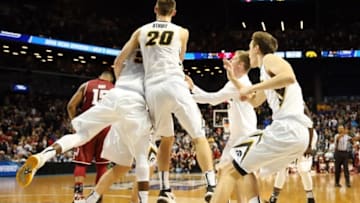 Mar 18, 2016; Brooklyn, NY, USA; Iowa Hawkeyes players celebrate with center Adam Woodbury (rear) after Woodbury made the game-winning basket in overtime against the Temple Owls in the first round of the 2016 NCAA Tournament at Barclays Center. Mandatory Credit: Anthony Gruppuso-USA TODAY Sports