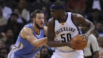Jan 8, 2016; Memphis, TN, USA; Memphis Grizzlies forward Zach Randolph (50) handles the ball against Denver Nuggets center Joffrey Lauvergne (77) during the second half at FedExForum. Memphis Grizzlies defeated Denver Nuggets 91 - 84. Mandatory Credit: Justin Ford-USA TODAY Sports