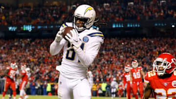 KANSAS CITY, MISSOURI - DECEMBER 13: Wide receiver Mike Williams #81 of the Los Angeles Chargers catches a pass for a touchdown as defensive back Orlando Scandrick #22 of the Kansas City Chiefs defends during the 4th quarter of the game at Arrowhead Stadium on December 13, 2018 in Kansas City, Missouri. (Photo by David Eulitt/Getty Images)